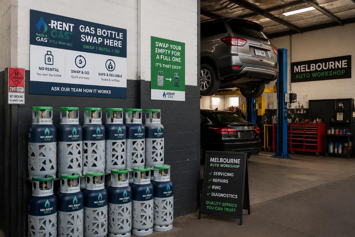 A small automotive workshop with stacked no-rent gas bottles ready for swap and refill