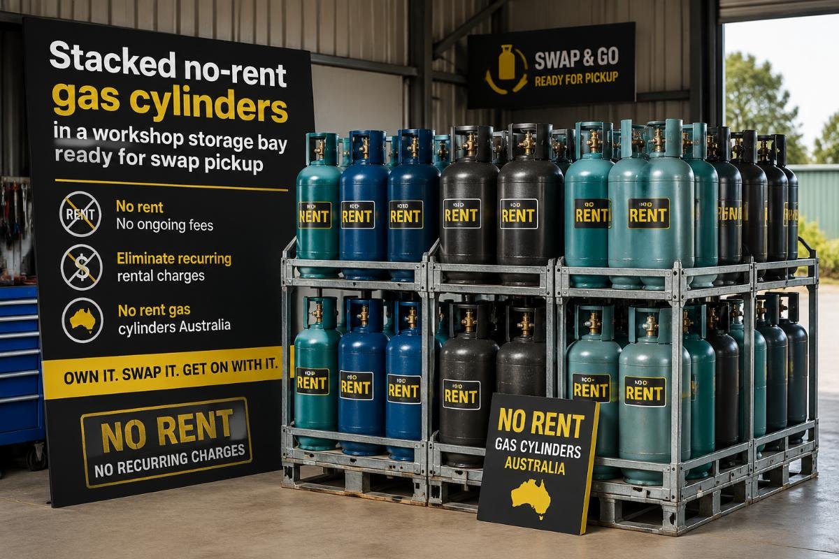 Stacked no-rent gas cylinders in a workshop storage bay ready for swap pickup